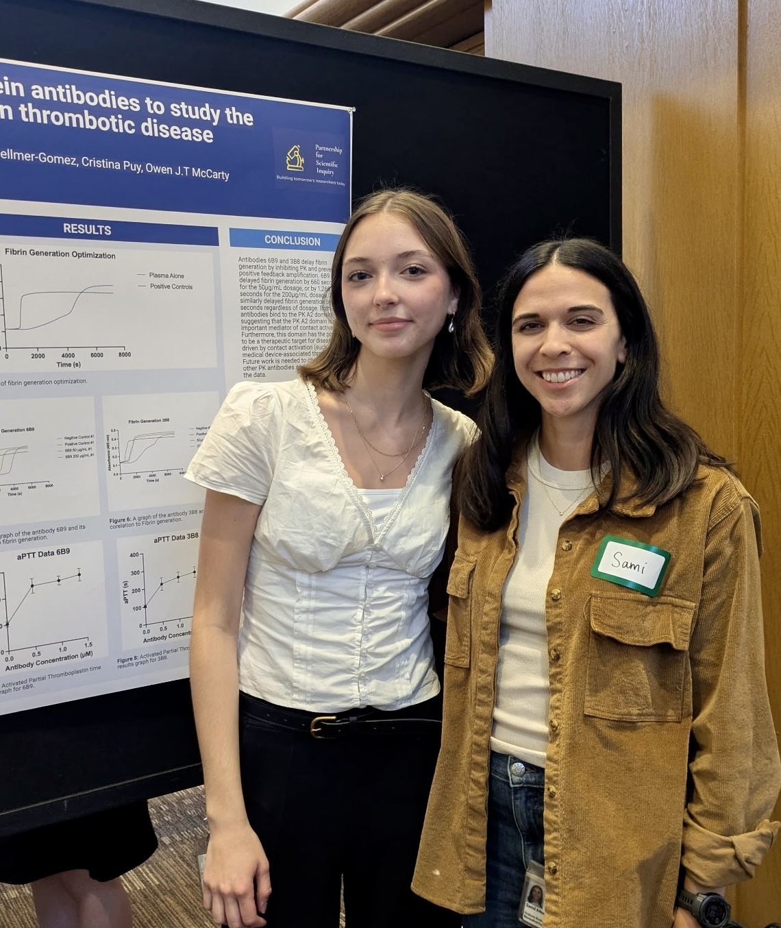 PSI student Autumn Schnathorst with her mentor at a poster presentation